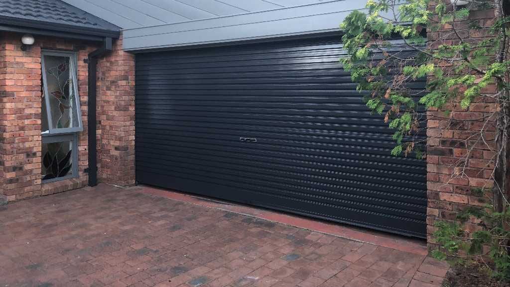 Garage Door & Exterior Repaint: Modern Black & Grey Update Added $28k to Pre-Sale Valuation